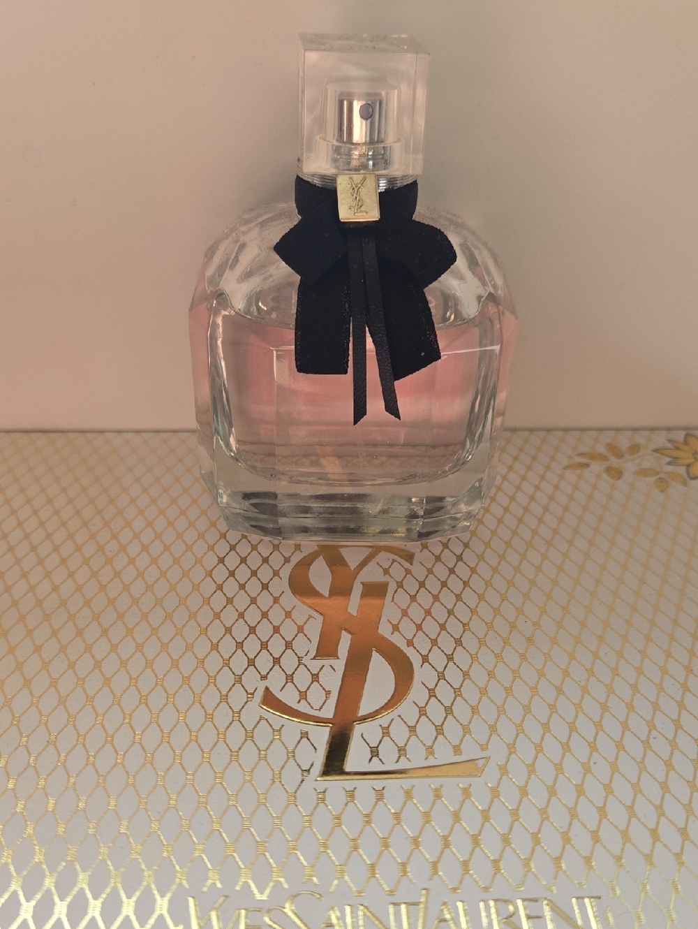 Yves Saint Laurent Glass Perfume Bottle with Black Bow and Pink Liquid